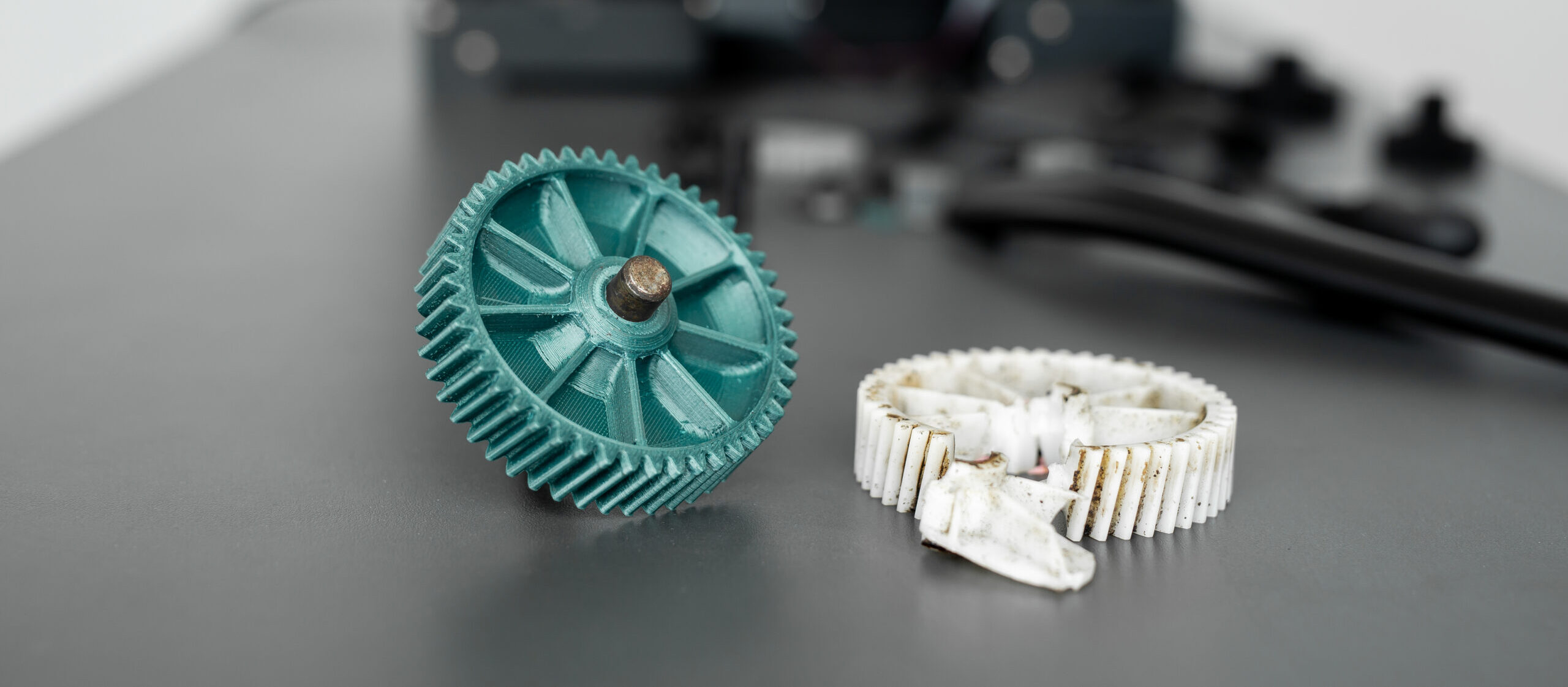 Manufactured part a 3D printer and a broken. custom 3d printed gear replacing a worn or broken gear