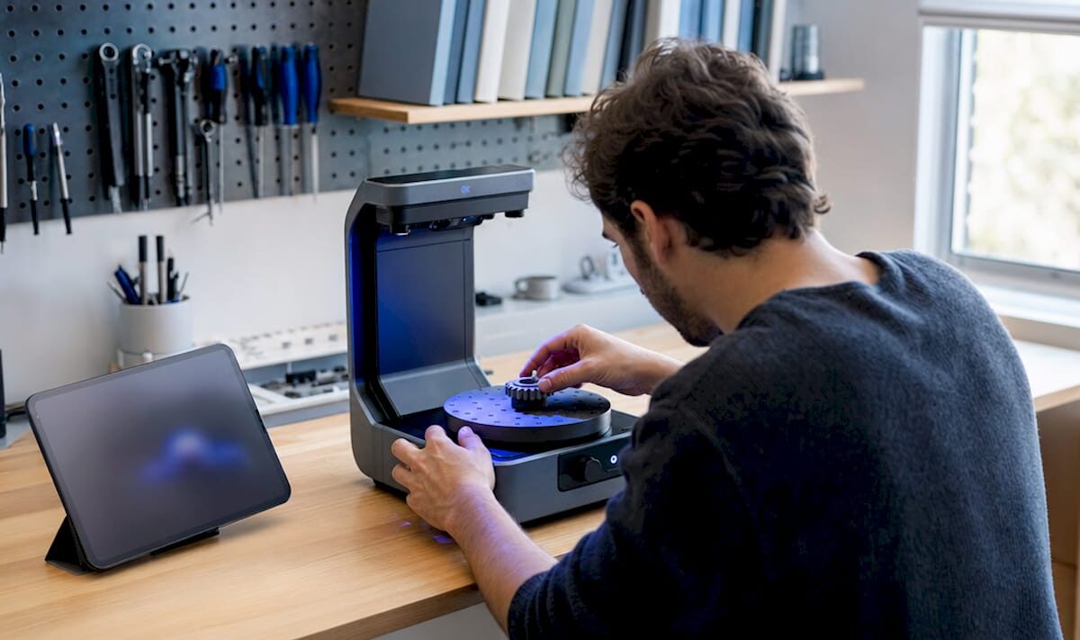 Technician scanning small mechanical part