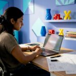 Woman typing custom 3D print quote request email