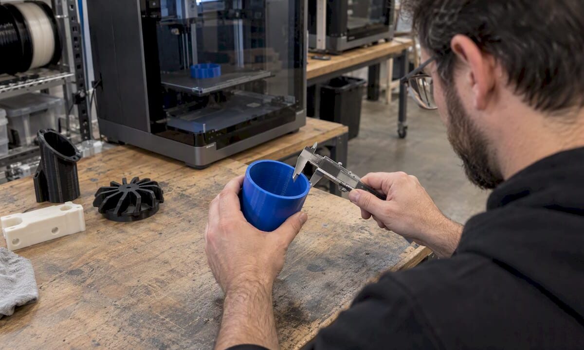 Calipers measuring a food-contact FDM print
