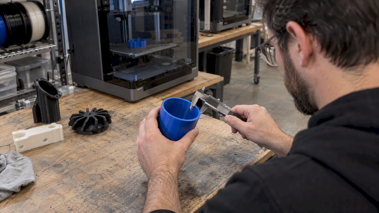 Calipers measuring a food-contact FDM print